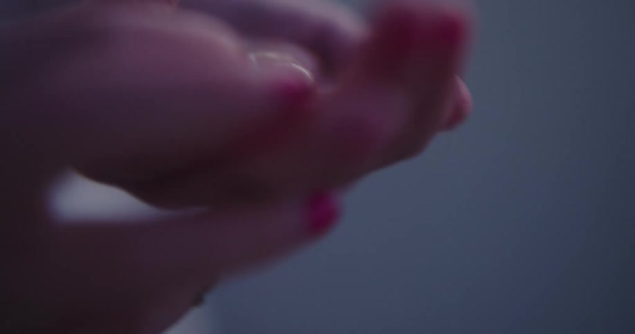 Close up of a pair of childs hands holding seashells