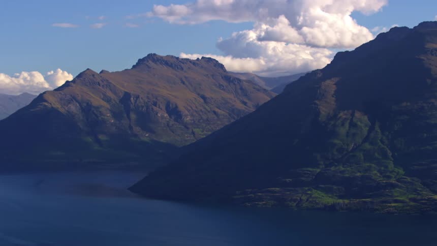 The mountains reach down to the lake