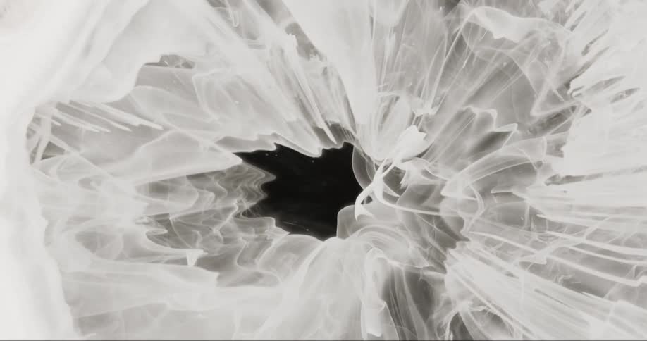White texture with black hole in the background in abstract motion