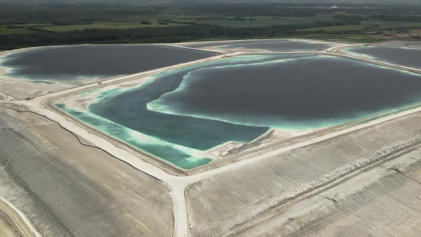 Aerial view of many large outdoor pools used in industrial processes