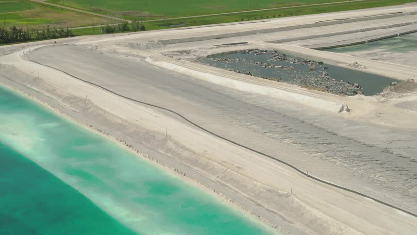 Industrial wastewater and soil sits amongst farms on the prairies