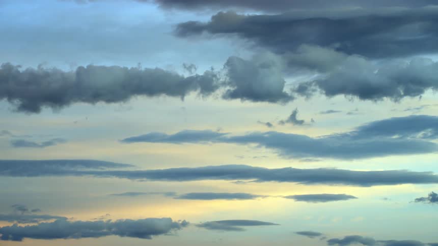 View of the sky with clouds and the morning sun reflection