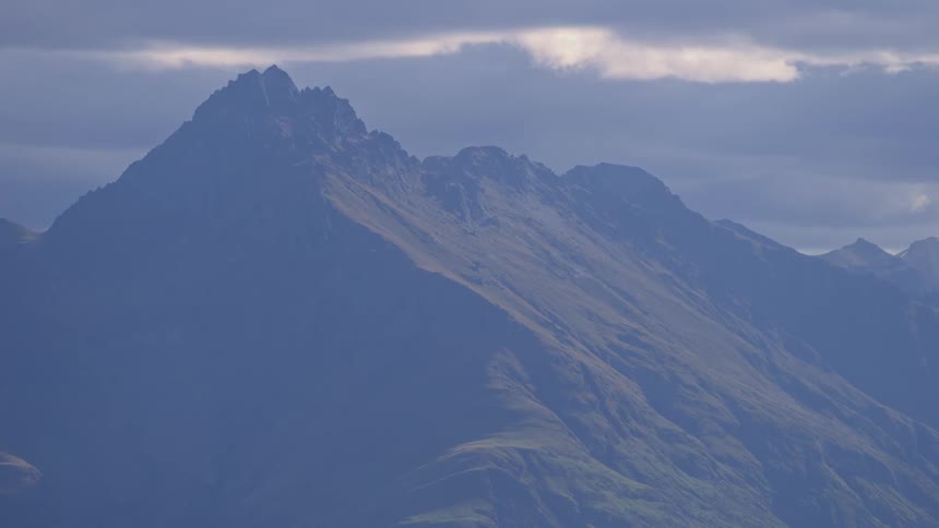 Rocky mountains with ridges and cliffs on a cloudy day