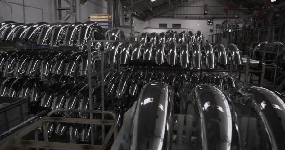 Bicycle mud guards stacked on racks in warehouse