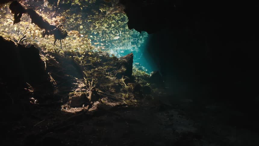 Water cave with sunlight reflection