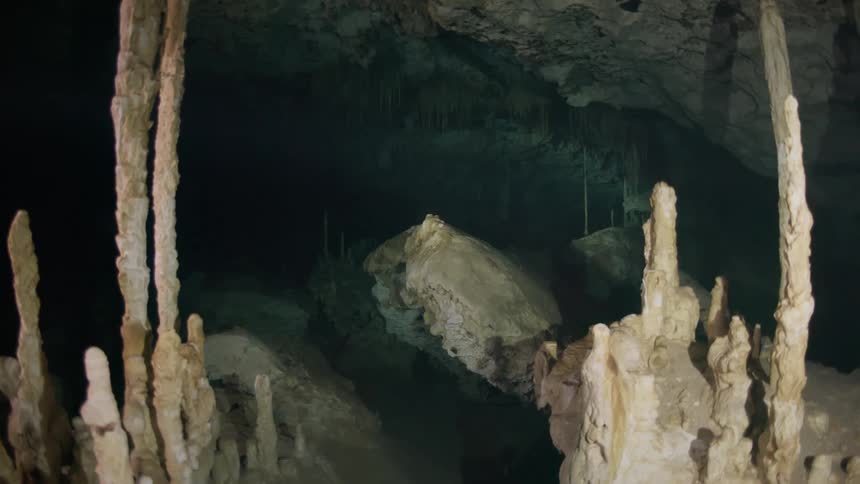 The cave is dark and full of jagged rocks
