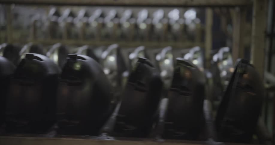 Metal parts are organized on shelving units