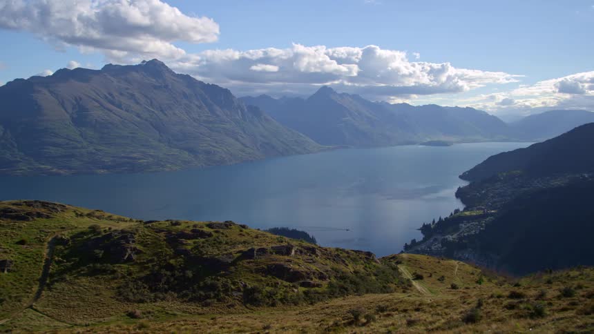 Calm blue lake that is boxed in by mountain ranges