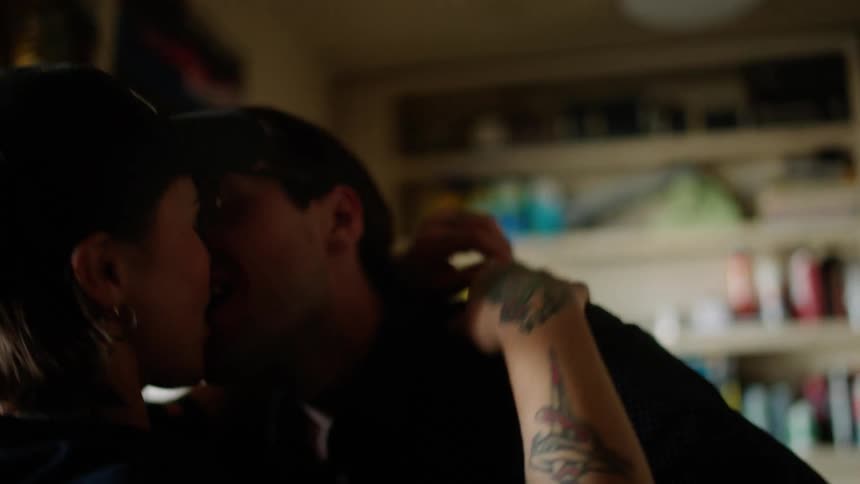 A man lifts a woman up and hugs her