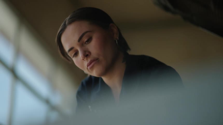 Portrait of a woman working in an indoor space