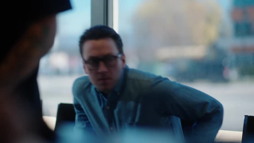 Man sitting on a chair in a commercial establishment