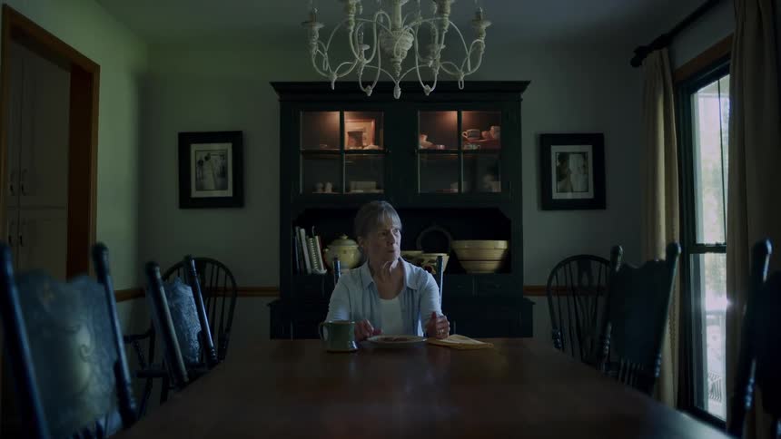 Woman sitting at a lonely table eating lunch