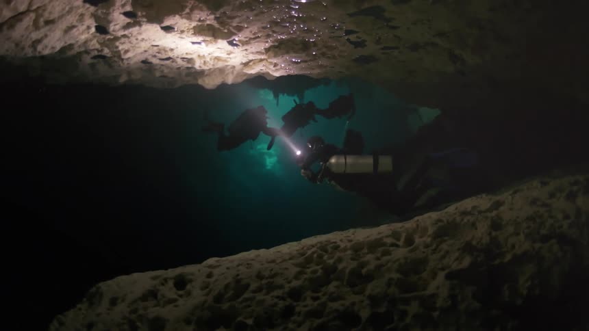 Group of divers in an aquatic cave