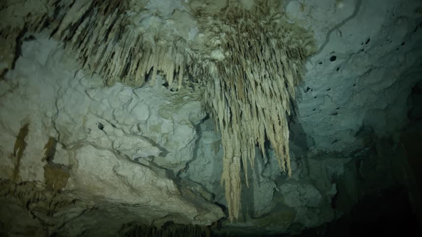 The cave is dark and full of shadows