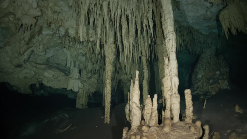 View inside a cave with sharp and aquatic formations