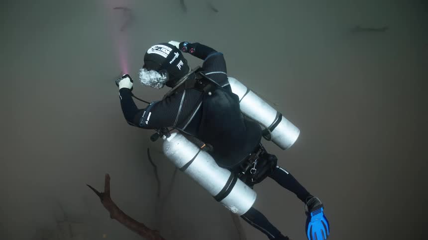 Bubbles rise up from the scuba diver