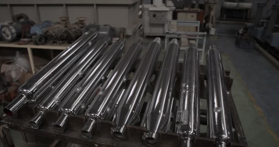Rack of metal parts that are sitting in a garage type area