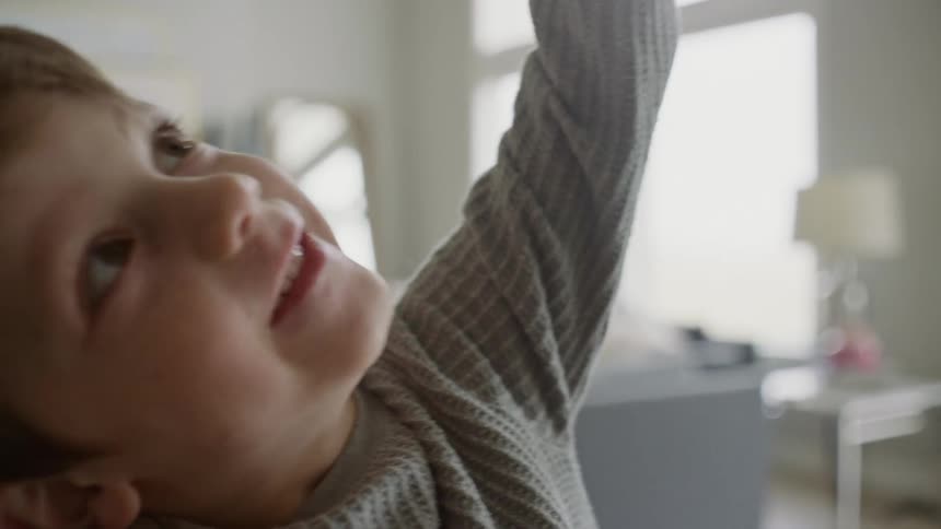Portrait of a small little boy playing alone