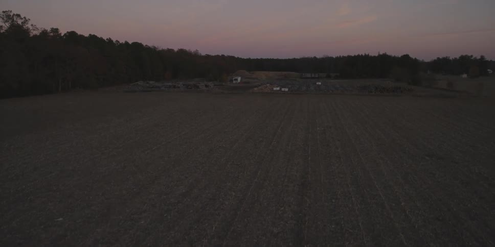 Overhead view of flat farmland at sunset