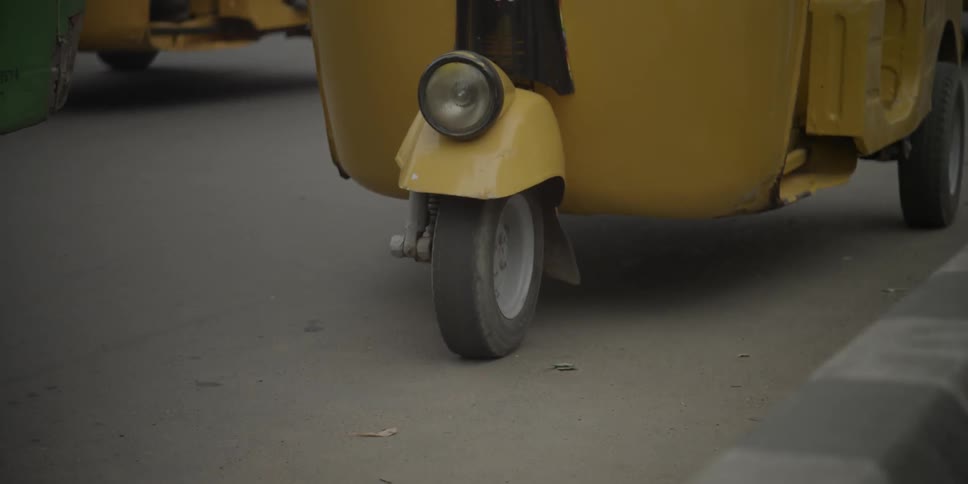 A yellow bike pulls forward