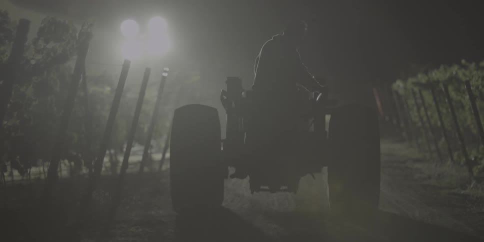 A farmer rides a tractor