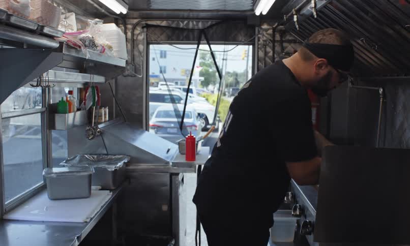 A man is working on the food truck