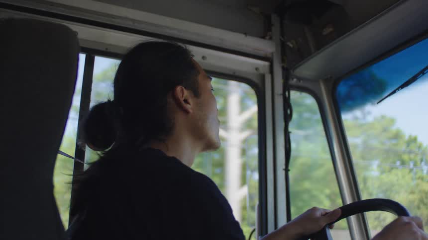 Food truck driver looking out the window while driving