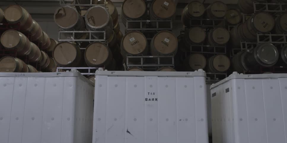 Barrels and tanks in a storage area