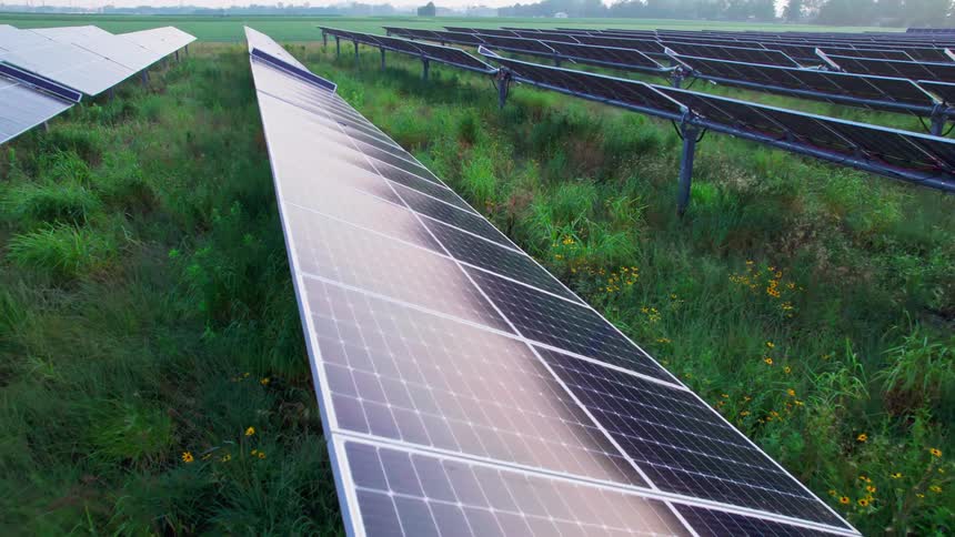 Solar panels on a green field