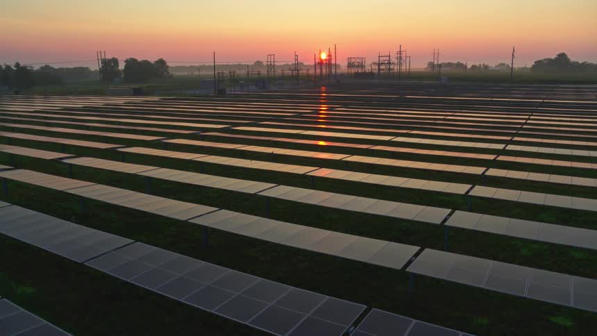 The sun is rising on the solar farm