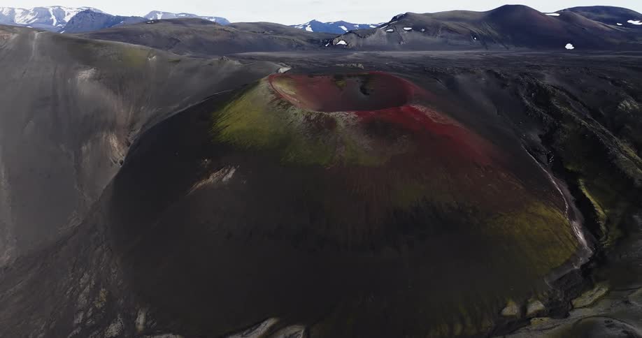 Volcanic crater and slope colored red and yellow border cliff in mountain range