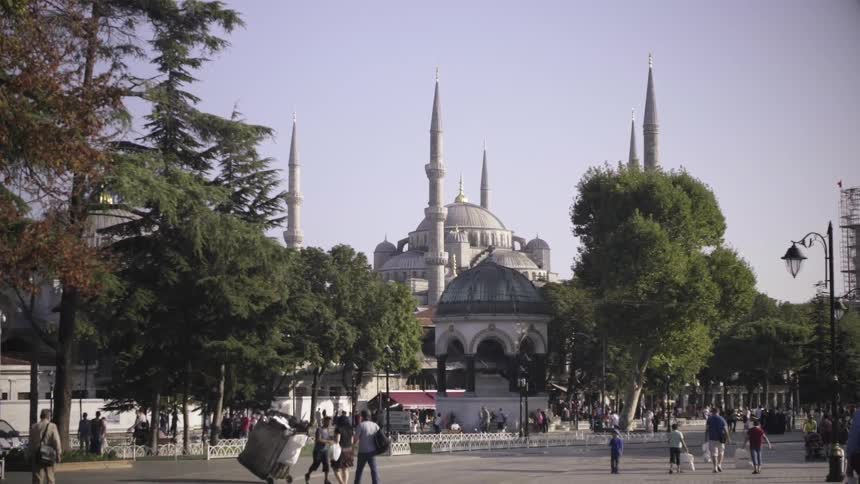 People walk through a city area