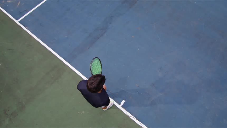 Top view of a man on the court playing tennis
