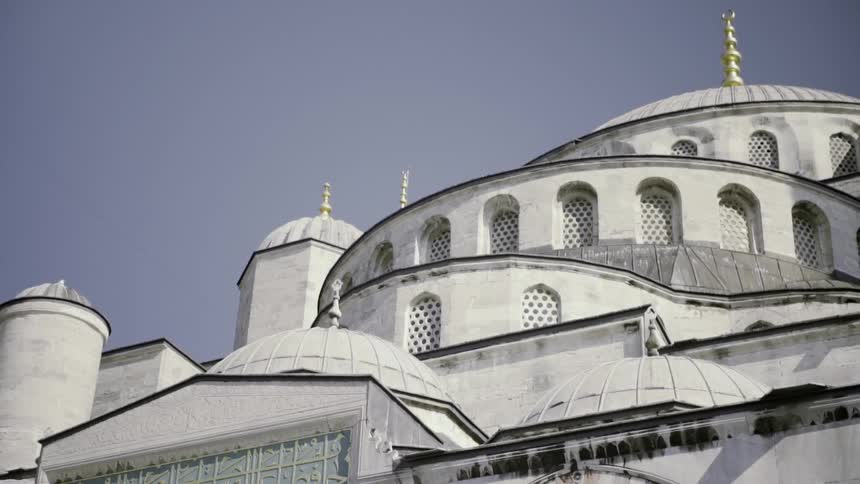 A white building with many towers and windows
