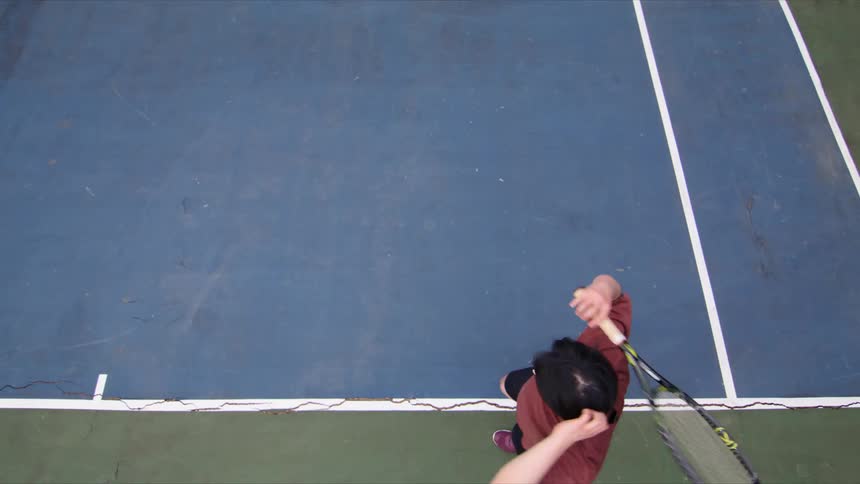 Man playing tennis and throwing his racket on the ground on the court