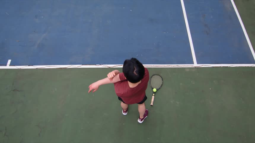 A man stretches before a tennis match