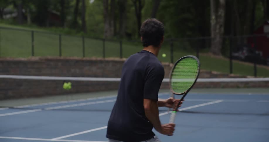 Two people play tennis