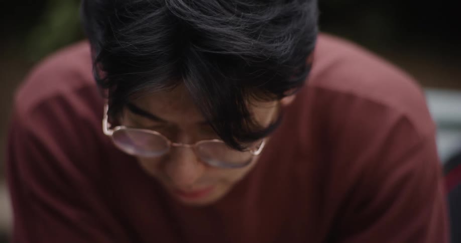 A man texts on his phone
