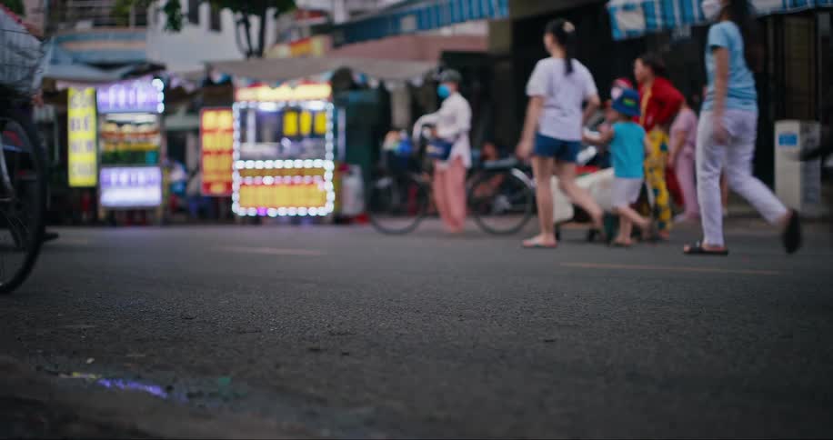 Busy street with shops and motorcycles