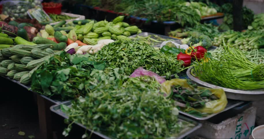 Grocery store with vegetables and greens for sale