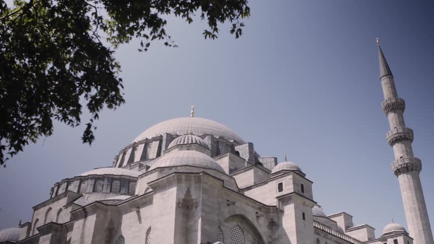 A large building has a dome ceiling at the top