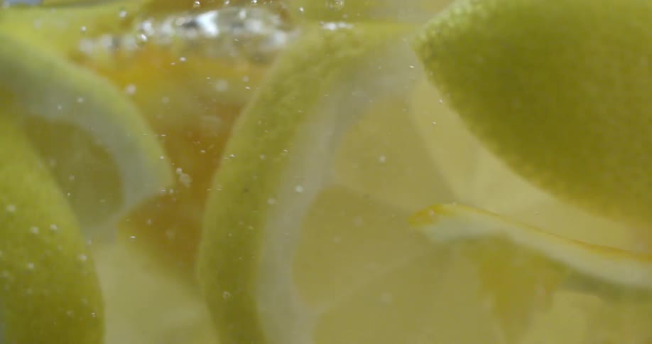 The water is filled with many lemon slices