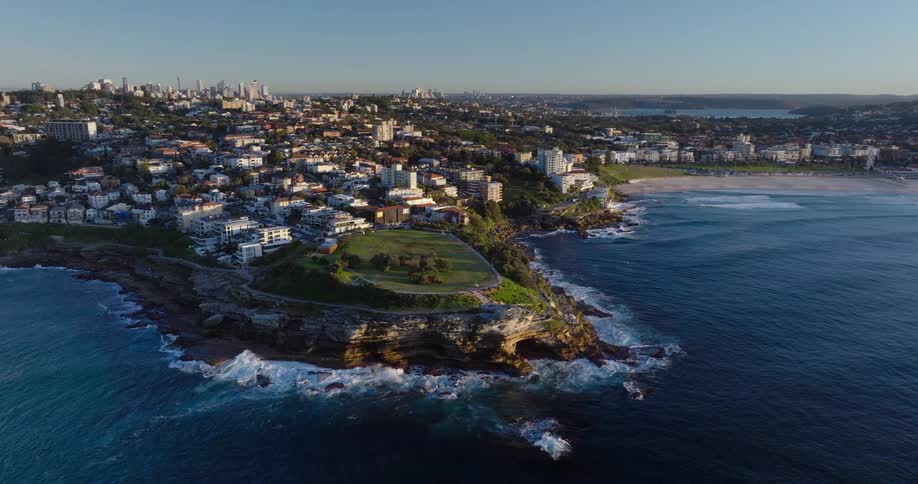 Aerial panorama of an urban city amidst a beachfront setting in the morning