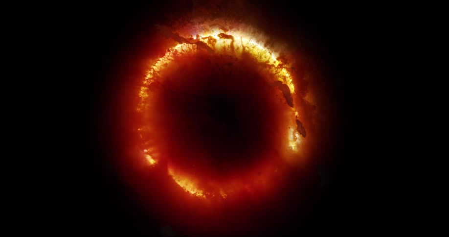 Red circle with debris against a black background