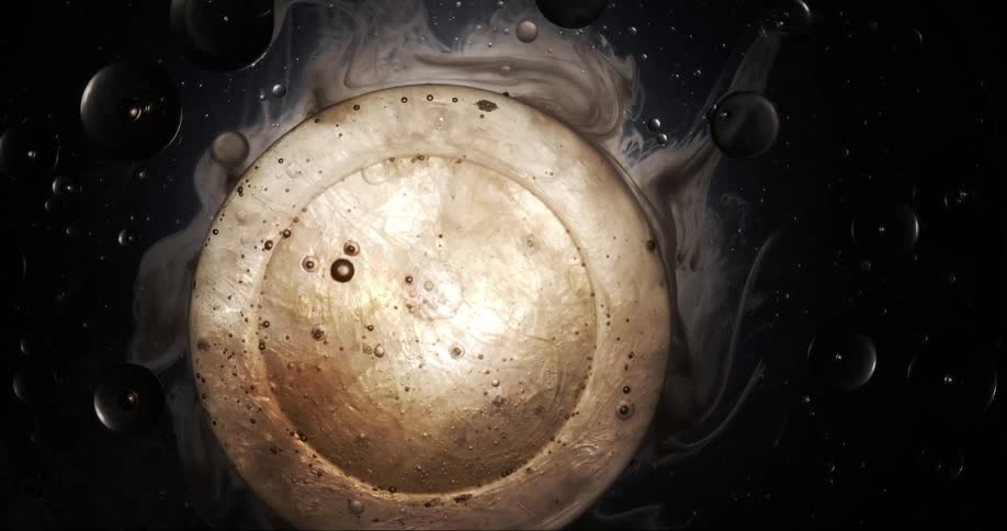 Extreme close up on abstract liquid bubbles against a black background
