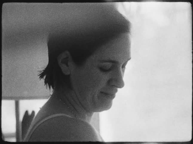 Close up of the face of a woman caught on vintage black and white film