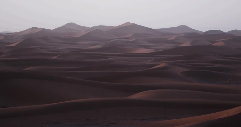 Desert dunes against a clear sky