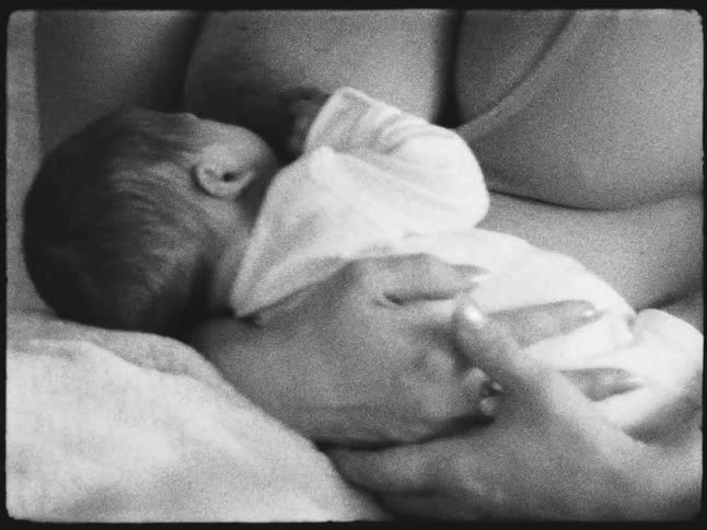 Mother breastfeeding her newborn baby