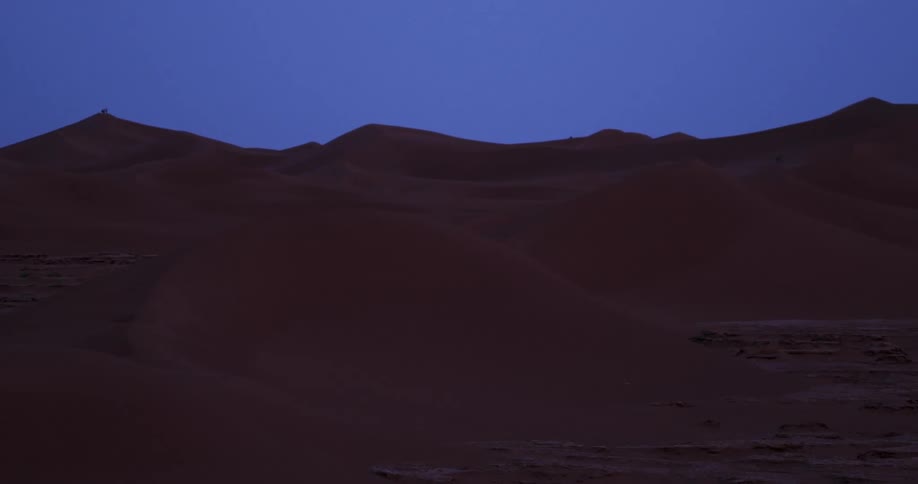 The serene cool hues of a desert landscape at twilight