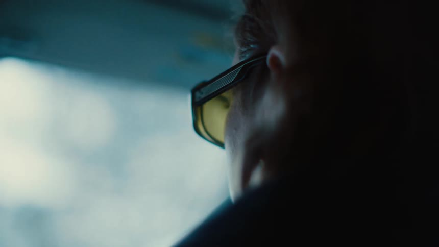 Side portrait of a man driving a vehicle